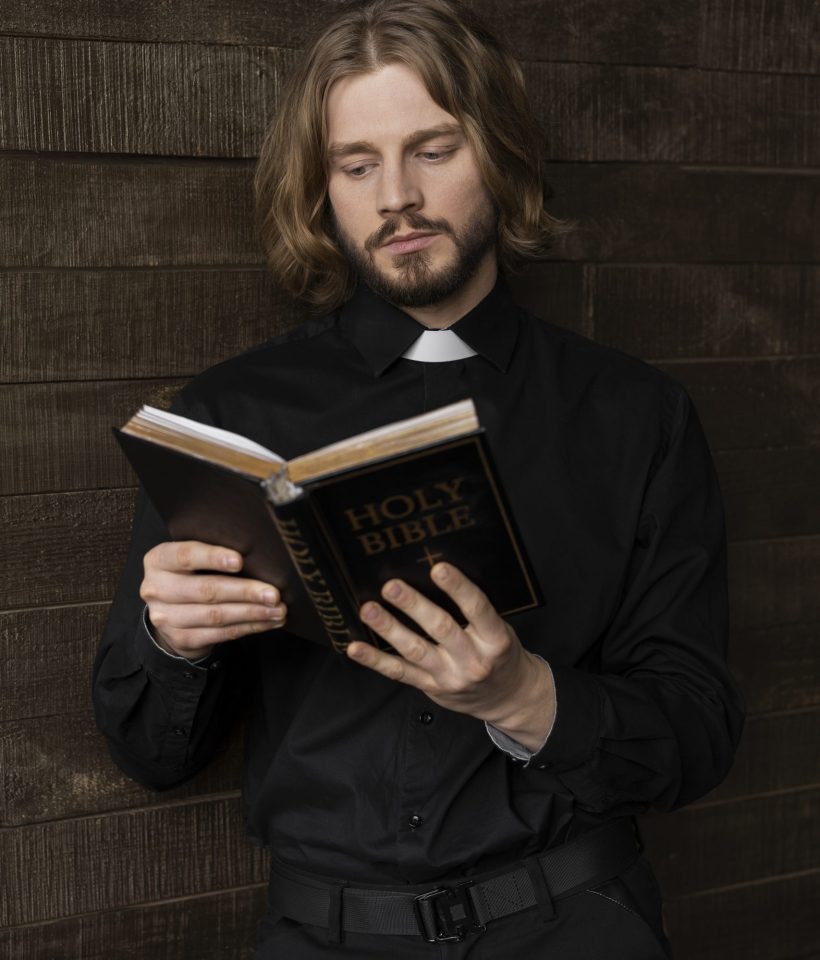 medium-shot-priest-reading-bible